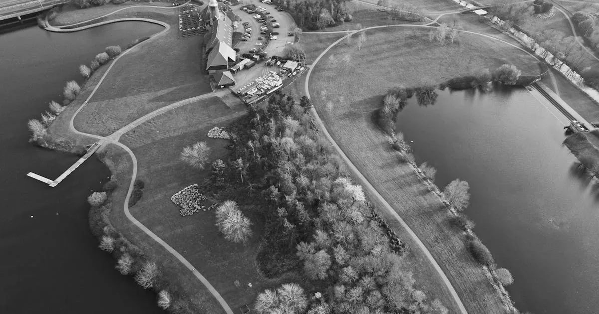 Aerial view of a beautiful English golf course with clubhouse and lush green surroundings