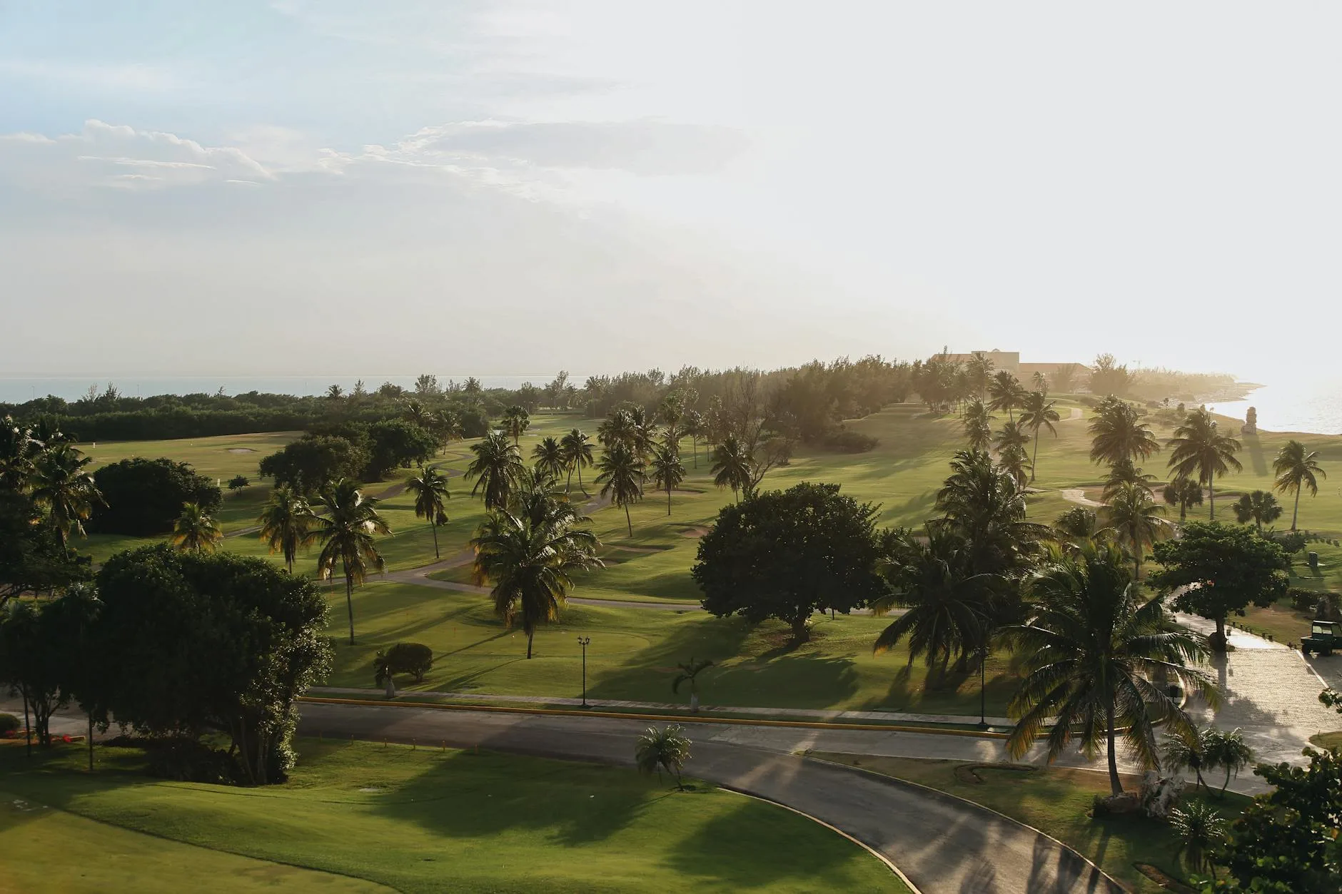 A luxury golf resort with a championship course set against rolling hills