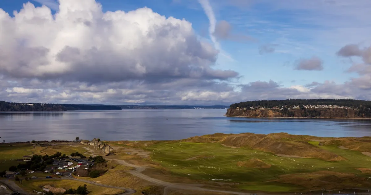 A links golf course on the Welsh coast with sea views and dramatic skies