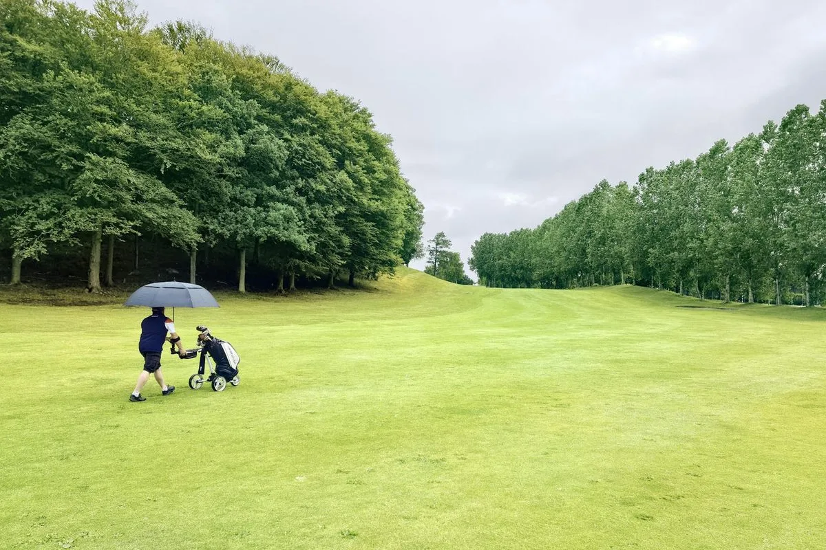 A lush parkland golf course fairway in the English Midlands on a sunny afternoon
