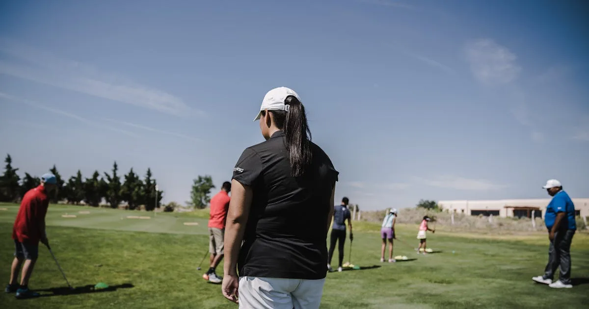 A beginner golfer at address position preparing to swing on a sunny fairway
